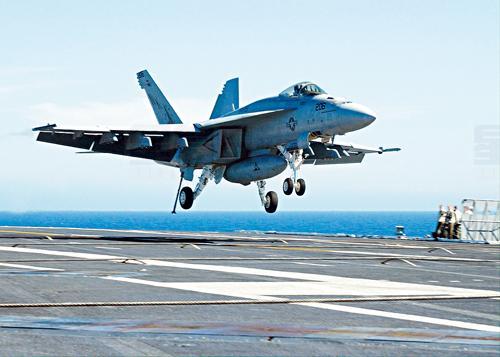 (FILES) A 24 July, 2002 file photo provided by the US Navy shows an F/A18 Super Hornet piloted by Lieutenant Corey L. Pritchard making the first carrier landing of the new aircraft onboard the USS Abraham Lincoln. Boeing has won a 9.6 billion dollars contract to supply the US Navy with 210 F/A-18 Super Hornet fighter aircraft and to develop a new version of the plane for electronic warfare, the company said  29 December. (Kittie VandenBosch/US Navy AFP PHOTO