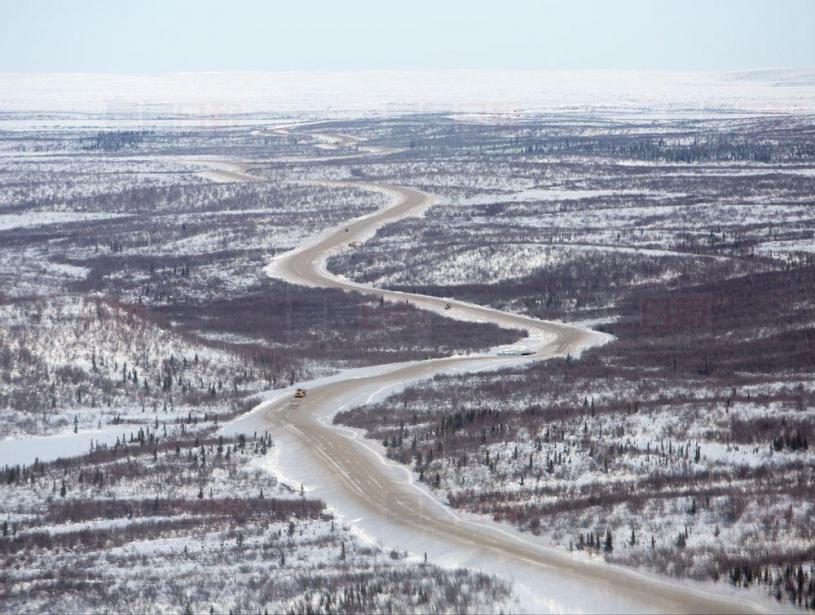 Construction happens on the Inuvik Tuktoyaktuk highway in Inuvik, NT in this undated handout photo. The new 120-kilometre all-weather gravel road, which opens Wednesday, is Canada's first land link to its Arctic coast. THE CANADIAN PRESS/HO-GNWT- James MacKenzie
