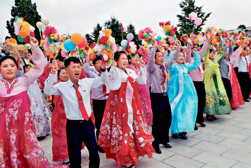 朝鮮民眾熱列歡迎習近平到訪。　新華社