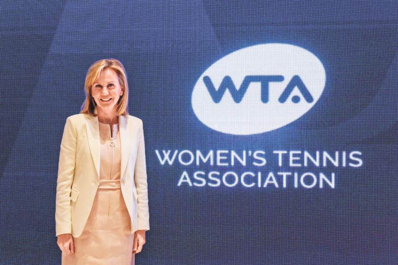 NEW YORK, NY - AUGUST 29: Micky Lawler, president of the Women's Tennis Association, poses in front of the WTA logo before ringing the opening bell at NASDAQ on August 29, 2019 in New York City.   Stephanie Keith/Getty Images/AFP
== FOR NEWSPAPERS, INTERNET, TELCOS & TELEVISION USE ONLY ==