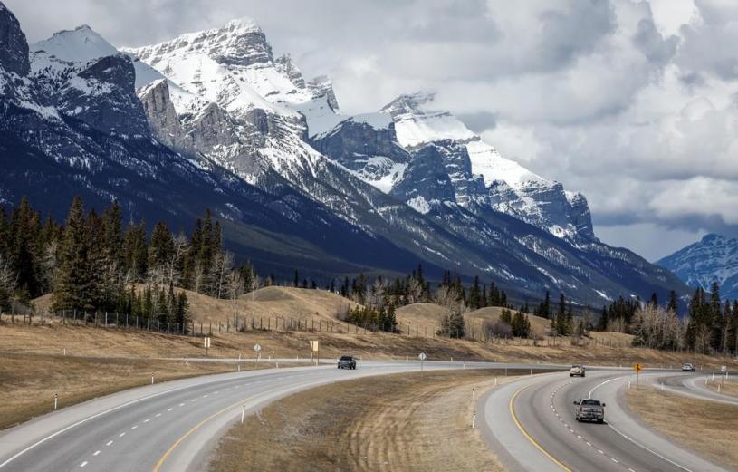 Traffic travels along the Trans Canada Highway past Mt. Rundle near Canmore, Alta., Monday, April 24, 2023.THE CANADIAN PRESS/Jeff McIntosh