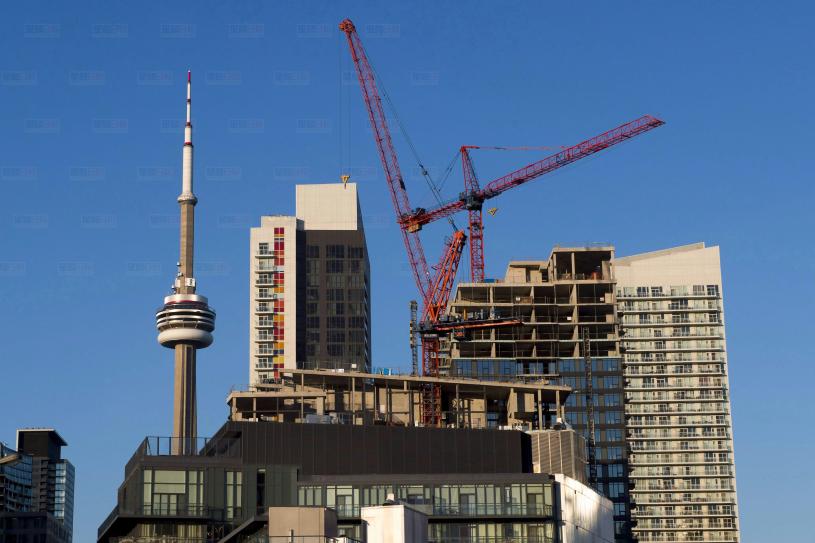 Construction cranes are seen in Toronto on Wednesday, July 5, 2017. Canada Revenue Agency is analyzing 2,810 transactions involving cases of pre-construction condominium flipping in Toronto to determine whether audits need to be carried out to find tax evaders. THE CANADIAN PRESS/Frank Gunn