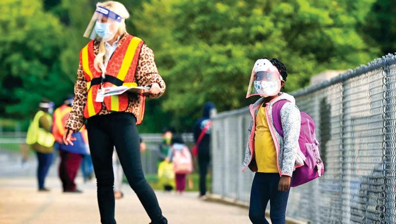 咸美顿教育局计划于下周一开课时，仍然维持戴口罩规定。加通社
