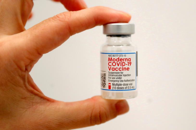 FILE PHOTO: A healthcare worker holds a vial of the Moderna COVID-19 Vaccine at a pop-up vaccination site operated by SOMOS Community Care during the coronavirus disease (COVID-19) pandemic in Manhattan in New York City, New York, U.S., January 29, 2021. REUTERS/Mike Segar/File Photo