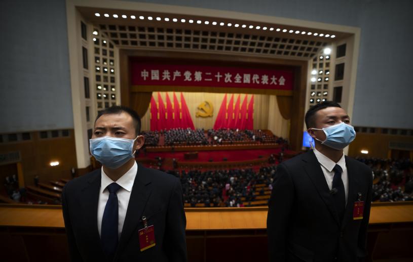 Security officers wearing face masks stand guard after the opening ceremony of the 20th National Congress of China's ruling Communist Party at the Great Hall of the People in Beijing, Sunday, Oct. 16, 2022. Chinese leader Xi Jinping signaled Sunday that his government would maintain policies that have put it at odds with the U.S. and other nations and deepened Communist Party control of the economy and society. (AP Photo/Mark Schiefelbein)