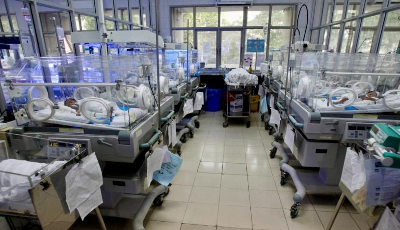 FILE PHOTO: Newborn babies lie in warming boxes at the special care ward  at the Central Obstetrics Hospital in Hanoi October 27, 2011. REUTERS/Kham/File Photo
